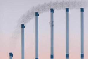 Smoke pipes in ascending row showing saturation curve with smoke added at the top. photo