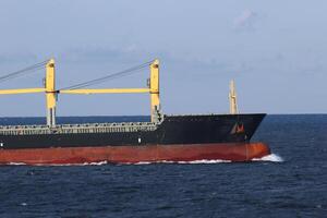 Freight ship in open water. photo