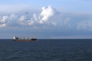 Freight ship cruising in open waters. photo