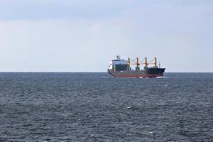 Freight ship cruising in open waters photo