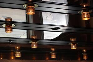Old fashioned incandescent ceiling lamps. photo