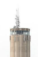 Concrete tower with antennas for telecommunication photo