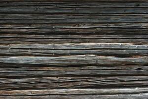Dark weathered wooden texture of log cabin photo