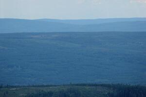 Different shades of blue seen from the mountain hastskar in Varmland, Sweden. photo