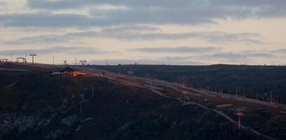 Evening sun on a Swedish ski slope in summer. photo