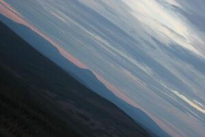Different shades of blue and orange seen from a Swedish mountain seen in unusual angle. photo