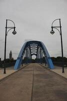 View to the Sternbruecke lit star bridge in Magdeburg, capitol of Saxony-Anhalt, Germany photo