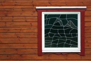 Wooden lath texture with ornamental window. photo