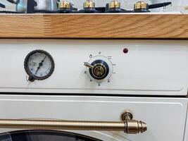 This image captures a detailed closeup view of a stove top oven featuring a clearly visible gauge that indicates its temperature and settings, perfect for culinary enthusiasts photo