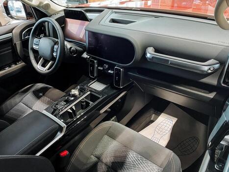 The interior of a car comprises several essential features, including the steering wheel and dashboard, both of which are key for ensuring effective operation and enhancing driver comfort photo