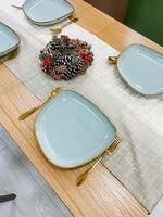An Elegant Dining Table Setting featuring beautiful Gold Accents coupled with delightful Seasonal Decorations that enhance the dining experience and aesthetics of any meal photo