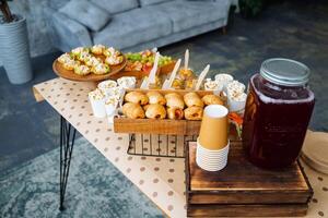 An elegantly set table with delicious food and exquisite drinks invites gathering, fostering connection, happiness, and a vibrant community spirit that brings everyone closer photo