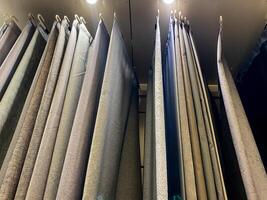 The store showcases a stunning array of beautifully arranged curtains, featuring diverse styles, colors, and designs that customers can use to enhance and elevate their living spaces photo
