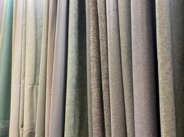 The elegantly displayed curtains on show effectively showcase a wide variety of unique textures coupled with vibrant colors, which capture the attention of potential customers effortlessly photo