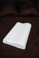 Soft pillow for correction of the back during sleep, orthopedic product made of parolon, photo