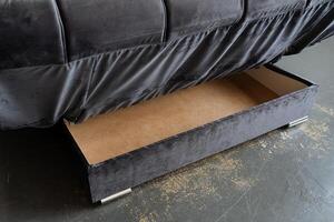 A stylish black couch that features a practical drawer conveniently located underneath it, providing extra storage space for various items and enhancing the functionality of the room photo