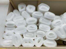 Neatly Rolled White Foam Pieces are Safely Stored in a Convenient and Organized Box, Ideal for Crafting, Packaging, and Various Creative Projects photo