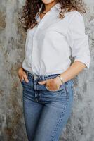 A stylish portrait of an elegant woman in a chic outfit, posing gracefully against a richly textured background, adding depth to the image photo
