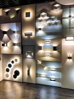 A large wall displays an impressive variety of stunning lighting fixtures, offering customers a visually striking array of illumination choices based on their preferences photo
