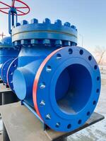 This image shows a closeup of a vivid blue pipe with a striking red flange, emphasizing its unique color combination and key industrial design features that enhance its aesthetic appeal photo