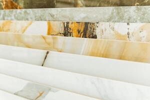 The image displays a selection of marble tiles suitable for flooring, offering a variety of colors for versatile design choices. Key terms mentioned are rectangle, asphalt, brick, and wood photo