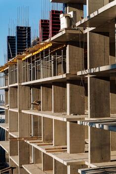 A large building that is currently under construction, showcasing a multitude of shelves being installed and utilized throughout the space, reflecting its developing status photo