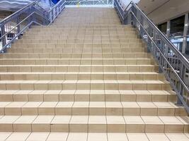 A wellconstructed and sturdy staircase equipped with a strong metal railing offers essential support and safety for individuals who are ascending or descending with ease and confidence photo