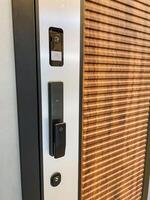 The image showcases a closeup of a beautifully designed door with a thoughtfully installed doorbell, highlighting the unique features of this often overlooked entryway accessory photo