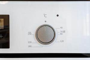 A detailed image of a modern ovens temperature control knob is ideal for enhancing efficiency in household baking and cooking in the kitchen, catering to culinary enthusiasts photo