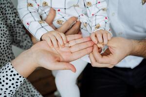 Capturing Family Bonds A Heartwarming Moment of Deep Connection Expressed Through a Childs Small Hands and Innocent Joyful Presence photo