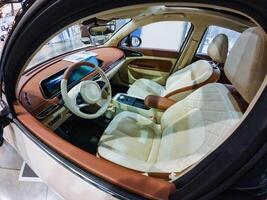 Inside a car, you will find essential features such as the steering wheel, various comfortable seats, and other components that contribute to the overall vehicle experience photo