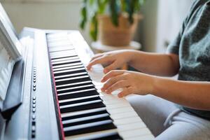 In a cozy and inviting living room, a talented pianist plays passionately, inviting everyone around to relax and enjoy the uplifting melodies that create a wonderfully joyful atmosphere photo