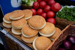 Enjoy Freshly Baked Sesame Burger Buns Combined with Fresh Produce Available at Your Local Market Today photo