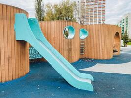 This beautifully crafted wooden playground features a fun slide and sturdy stairs for children, ensuring an enjoyable outdoor experience that inspires creativity and joy photo