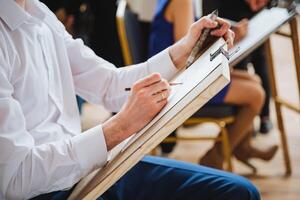 Musician in chair playing string instrument at event photo
