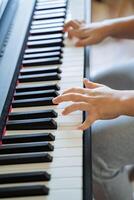 The Hands of a Child Engaged in Playing the Piano A Captivating Moment Marking Musical Discovery, Joy, and Individual Enjoyment Through Artistic Expression and Exploration photo