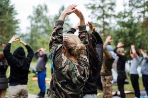 Encourage team bonding and community spirit by organizing group activities outdoors in a natural setting. Embrace nature and teamwork to promote fitness and wellbeing photo