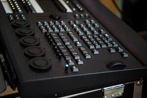 a black keyboard with a lot of buttons on it photo