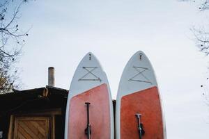 There are two surfboards prominently displayed, each featuring the letter x clearly marked on them, representing a unique style and design element that stands out visually photo