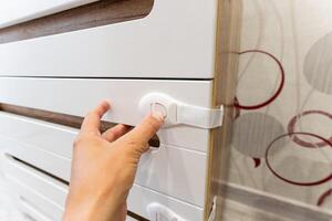 Installing a Child Safety Lock on Your Furniture Drawer for Enhanced Safety and Organization in your Home photo