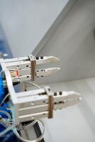 A detailed close up of a highly advanced robotic arm that features sharp and precise claws designed for intricate tasks and operations in various fields of engineering and manufacturing photo