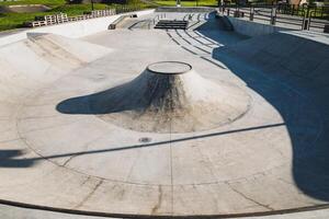 This aerial view showcases a vibrant skate park, a lively hub for skateboarders in wellmaintained urban surroundings, making it an ideal recreation spot for locals and visitors photo