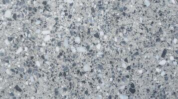 Polished Terrazzo Surface with Gray Blue and White Stone Patterns in Close Up View photo