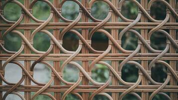 Closeup of Handwoven Bamboo Fence with Intricate Patterns and Natural Greenery Background photo