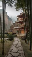 Traditional Japanese Pagoda With Bamboo Trees Stone Pathway And Mountainous Misty Background photo