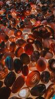 Polished Multicolored Agate Stones Closeup with Natural Patterns on Bright Surface for Decorative Use photo
