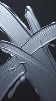 Abstract Metallic Silver Paint Strokes on Dark Background Expressing Creativity and Texture photo