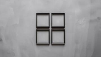 Minimalist Four Empty Black Picture Frames on Gray Textured Wall Background photo
