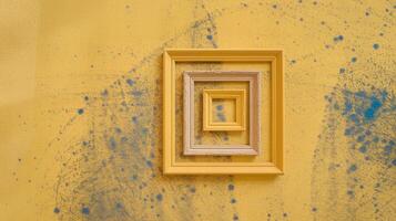 Yellow Wooden Nested Frames on Splatter Painted Wall with Blue Textured Abstract Background photo