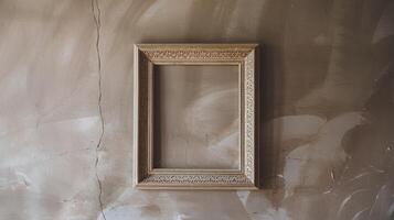 Ornate Empty Wooden Picture Frame Hanging On A Grungy Textured Beige Wall With Cracks And Stains photo